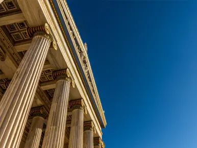A Greek temple with bright blue sky