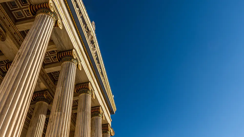 A Greek temple with bright blue sky