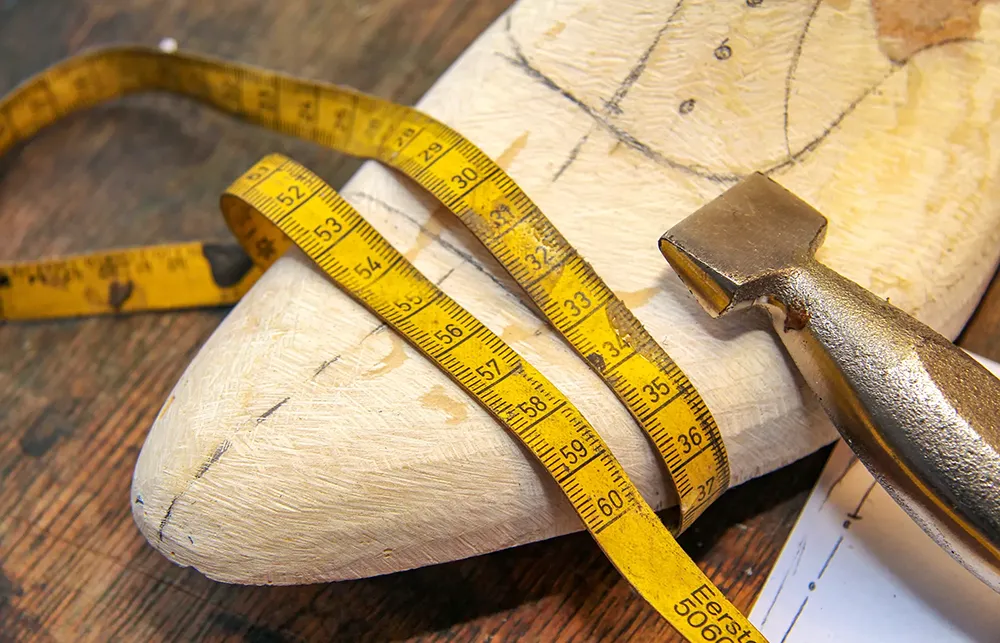 A shoemaker's last, symbolizing a bespoke journey.