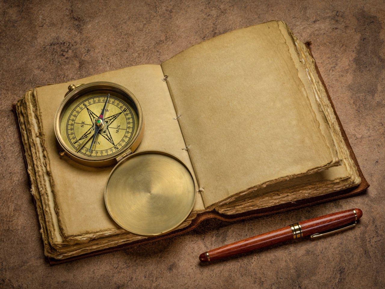 A journanl with a compass.