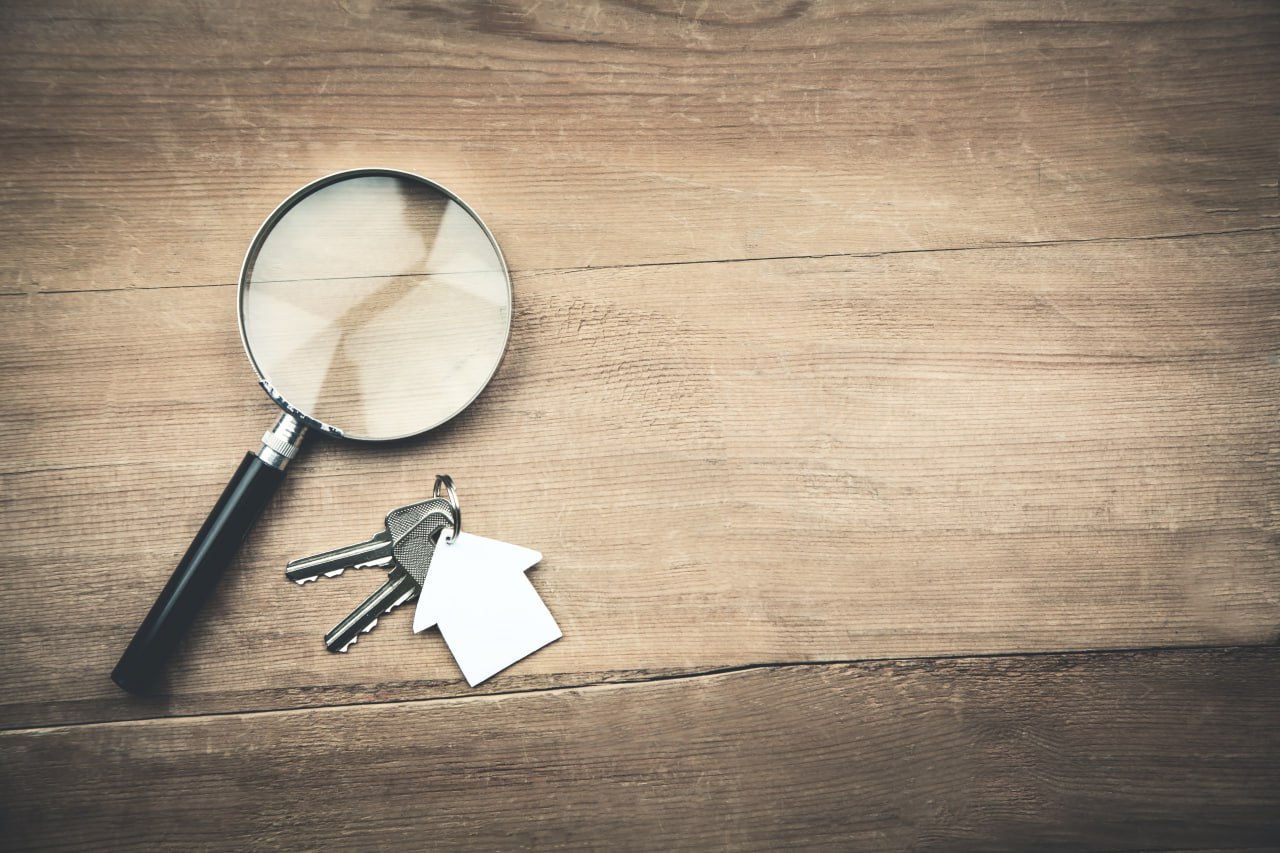 A magnifying glass and house keys.