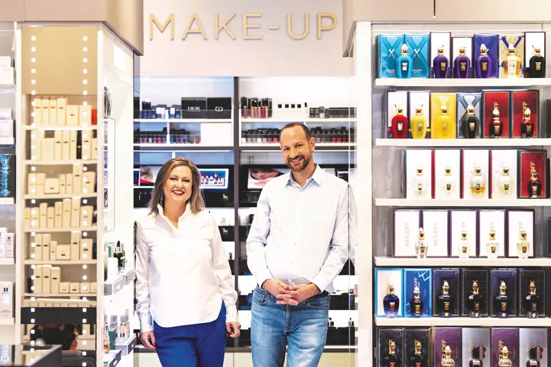 Image Credit: Nägele & Strubell Manging Directors Silvia Schwab-Stubenvoll and Georg Oelschlägel standing inside a Nägele & Strubell beauty and make-up area.