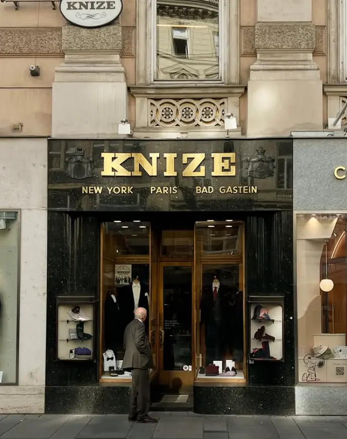 Image Credit: Knize Exterior of the Knize shop at Graben 13 in Vienna, with gold lettering above the entrance.