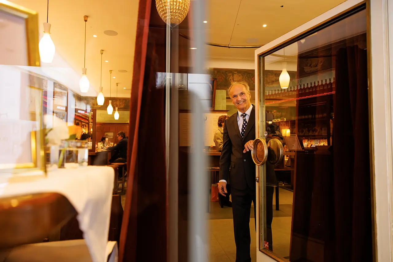Image Credit: Image Credit: Peter Rigaud The Current Owner and CEO Opening the Front Door Inviting You in