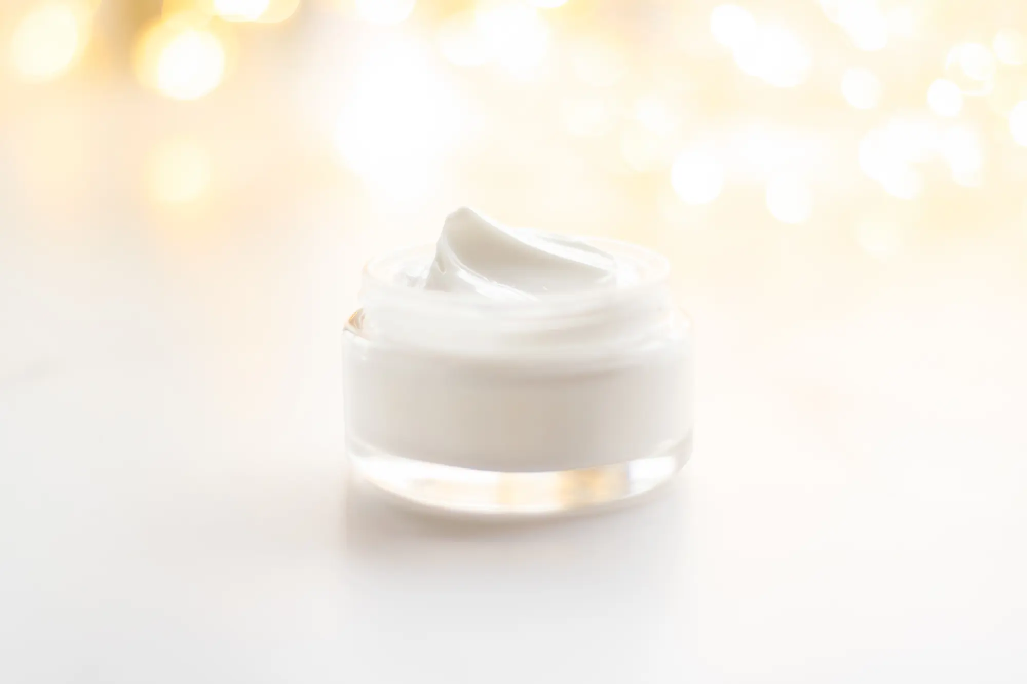 Luxury face cream jar and holiday glitter