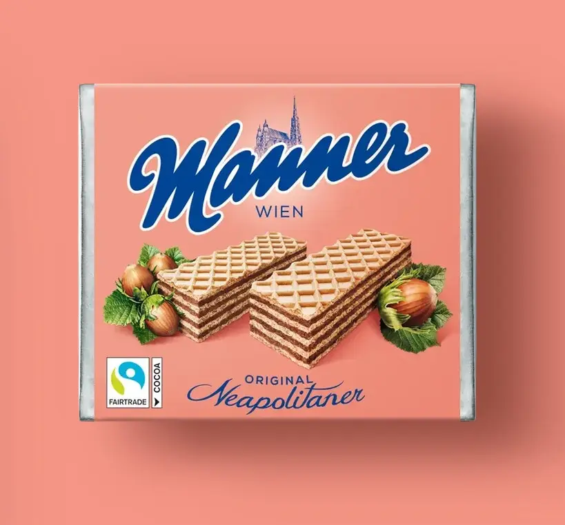 A packet of Mannerschnitte against the typical Manner pink background